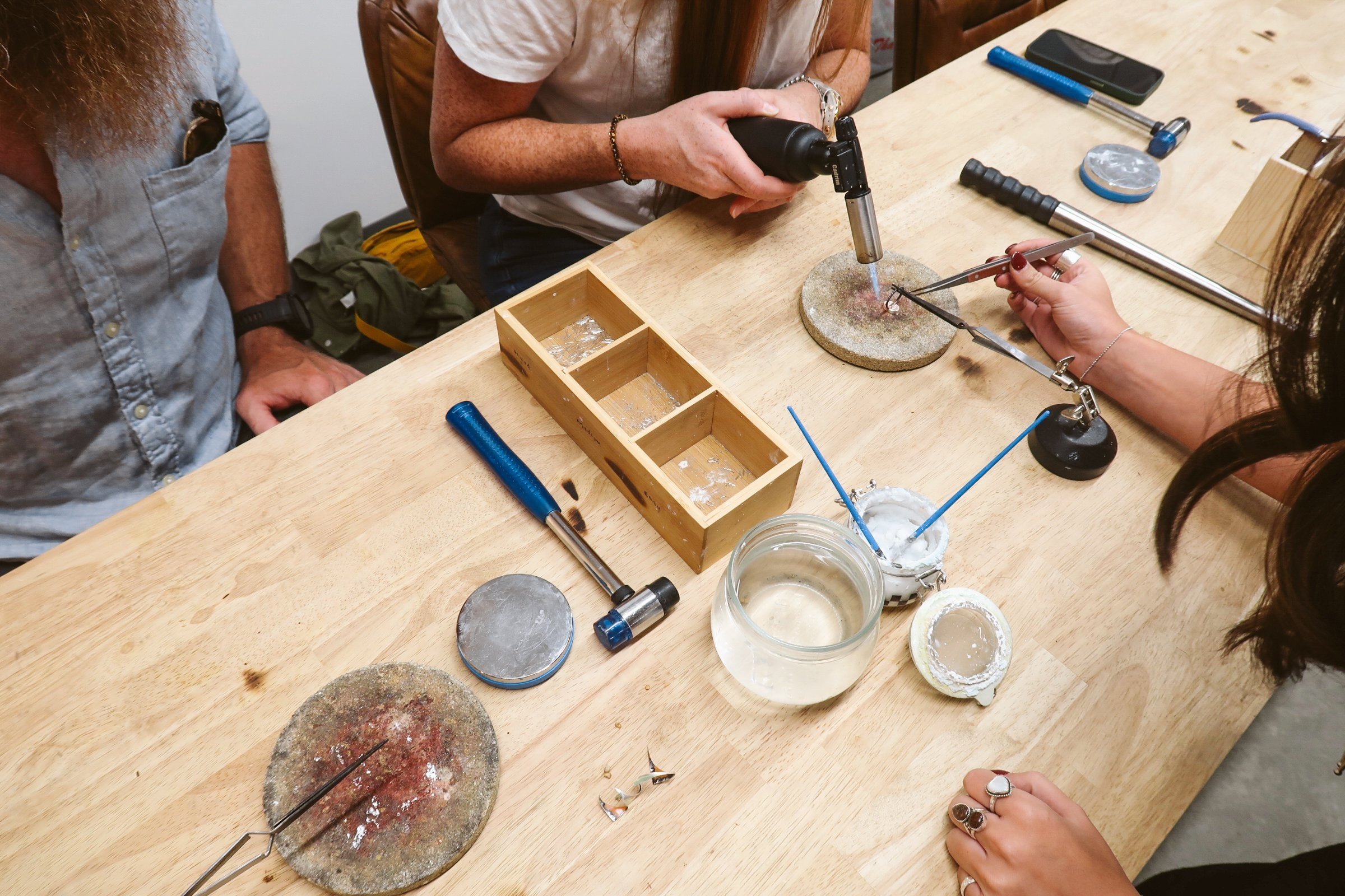 handmade bracelets, artisan tools, and creative workshop