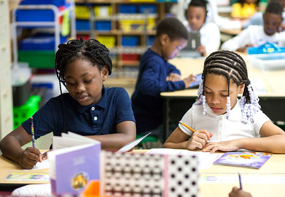 children writing classroom