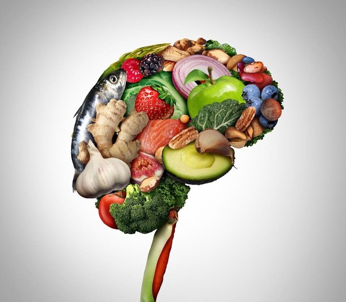 Assortment of healthy brain foods like fish, nuts, and berries