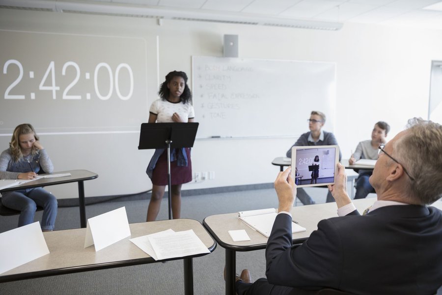 A speaker engaging with an audience during a presentation.