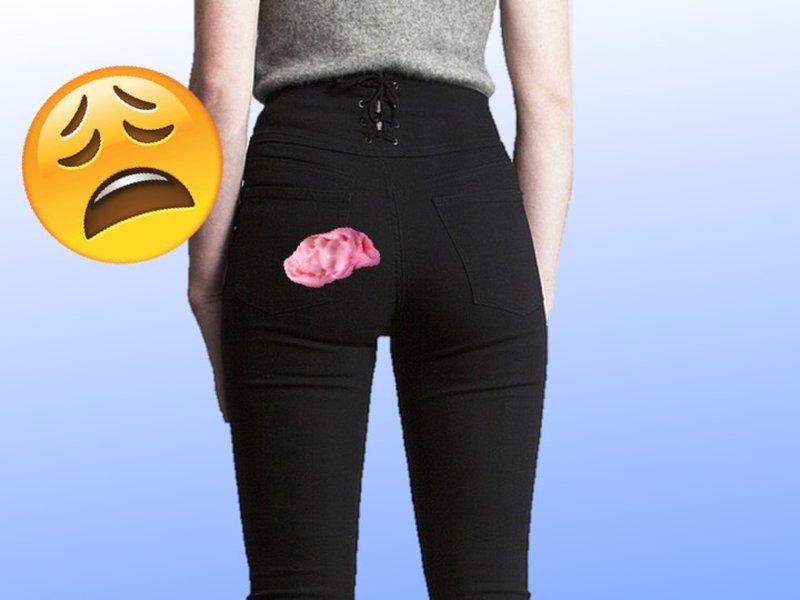 Applying peanut butter to gum on clothing