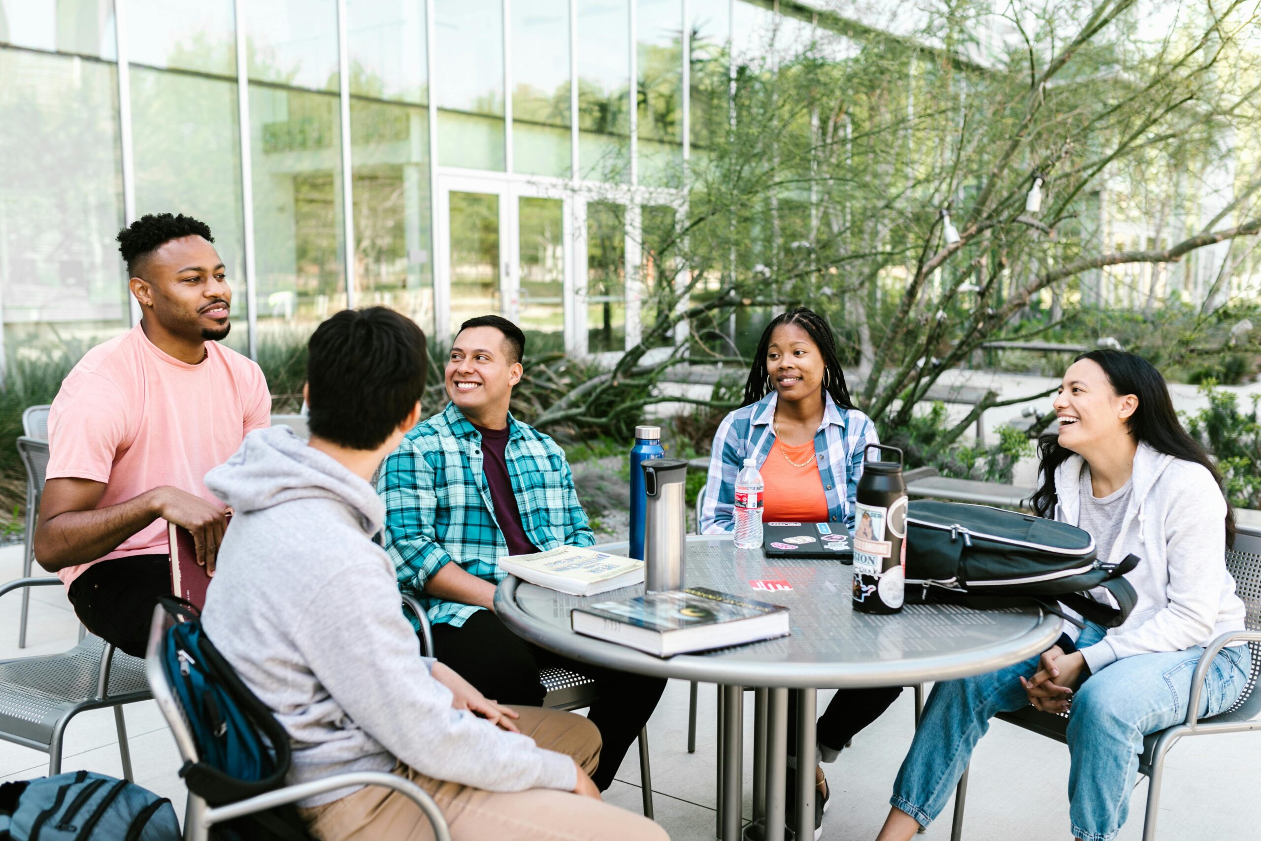 university campus building and leadership meeting