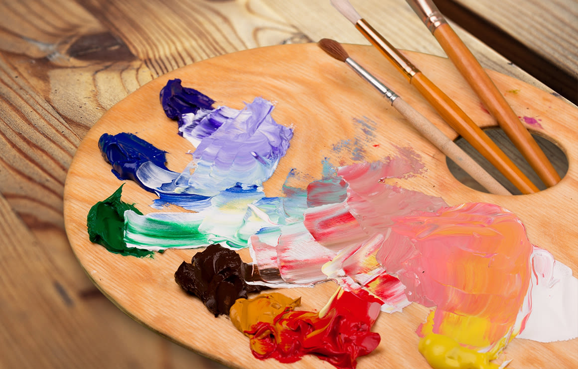 color palette with paint tubes and brushes