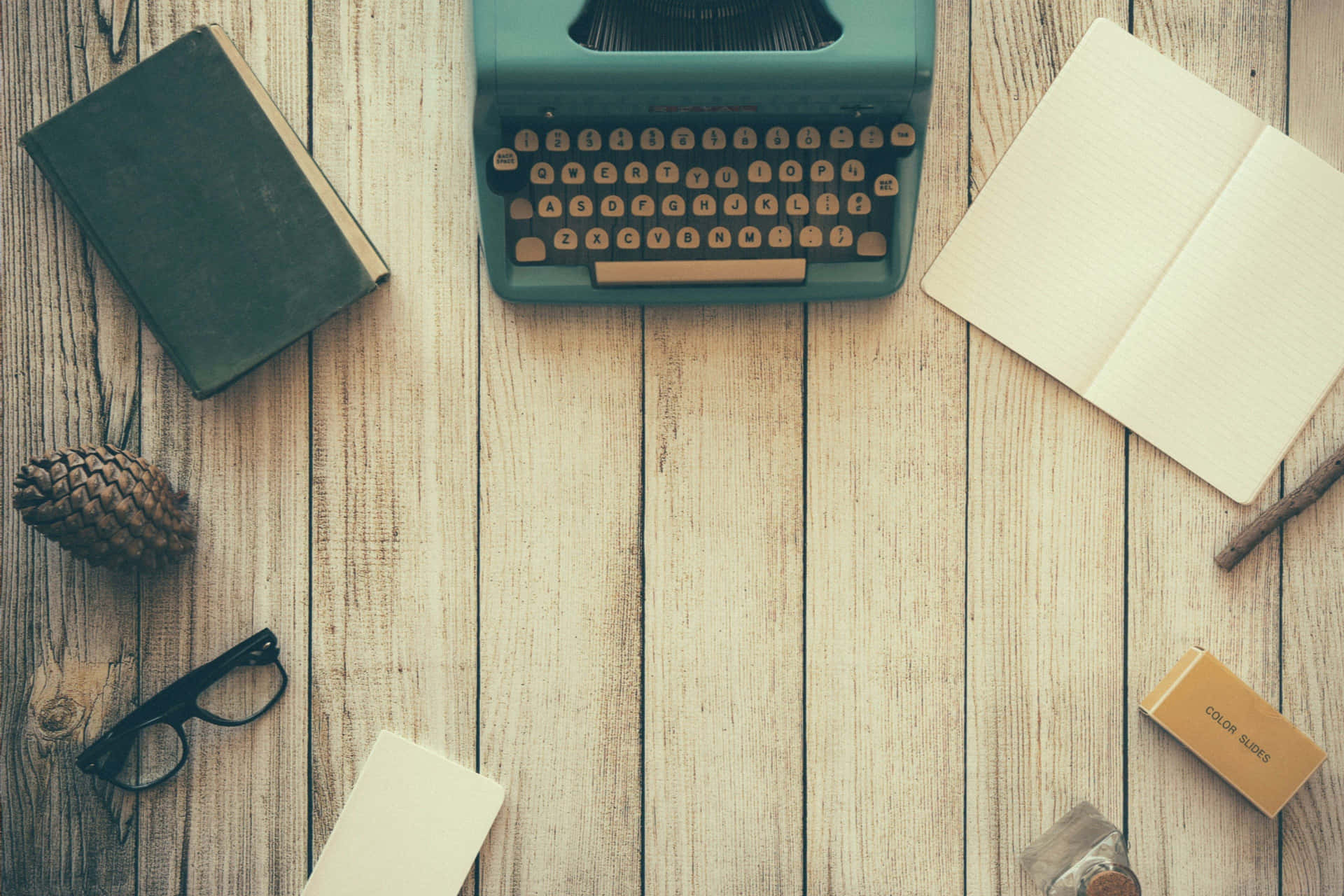 landscape typewriter and open notebook