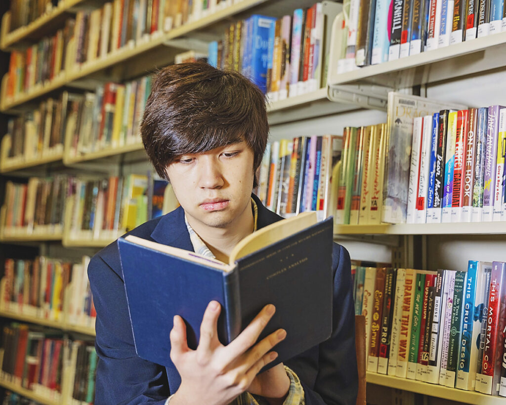senior high school student studying library