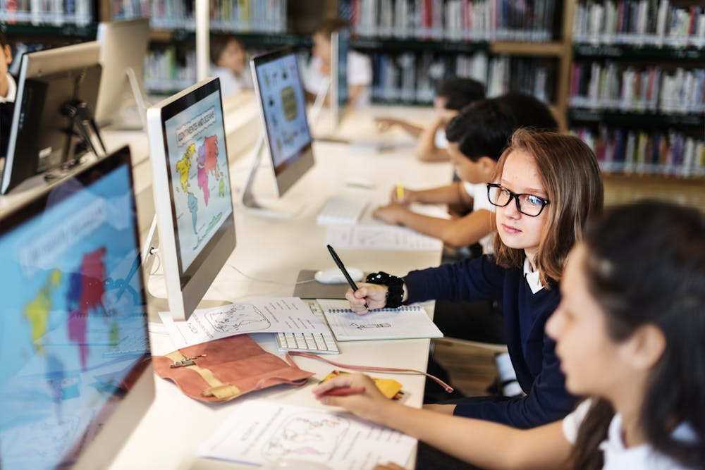 students using computers library