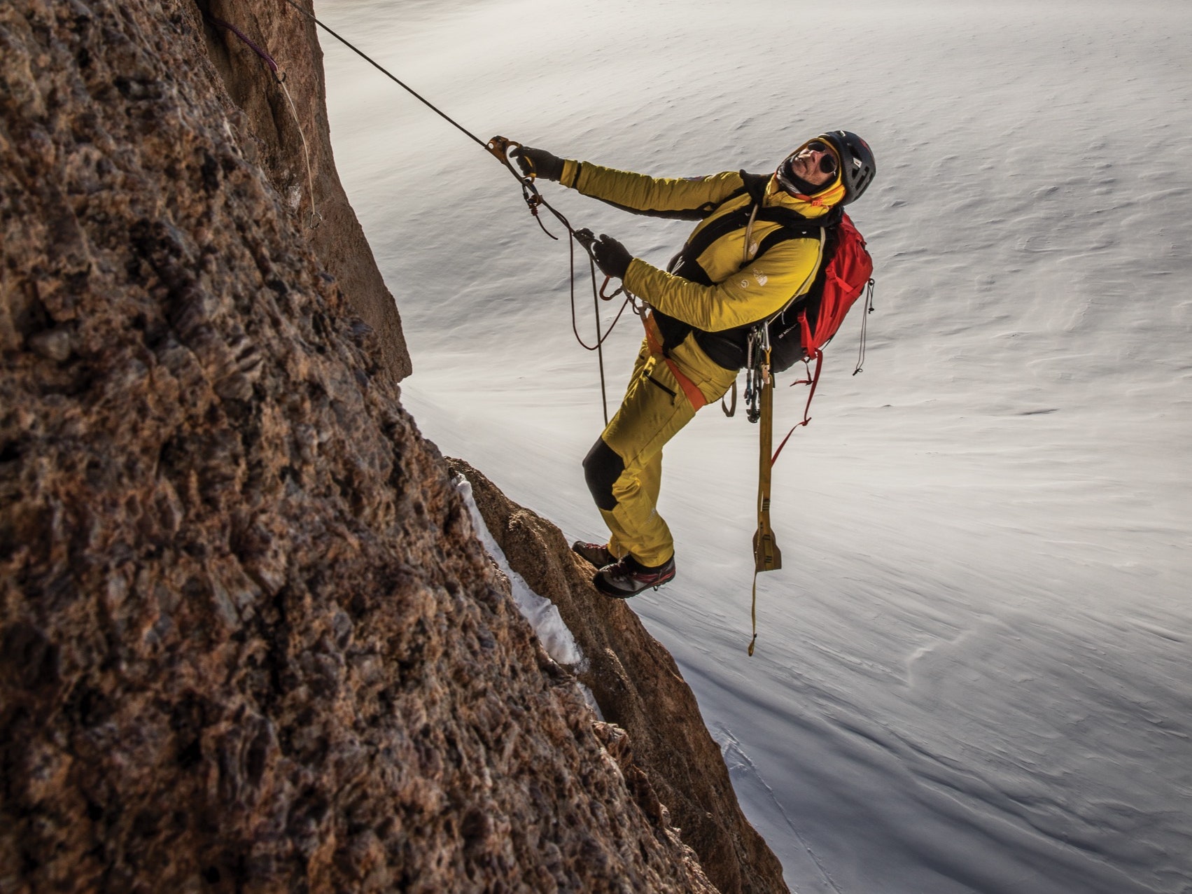 person climbing mountain