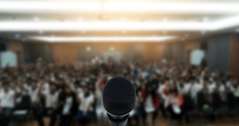 public speaking podium and audience