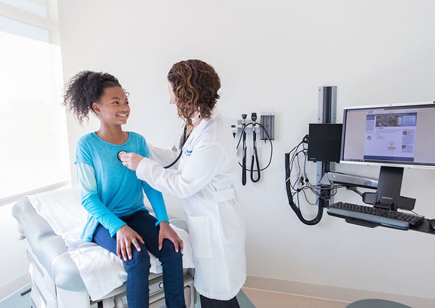 Doctor discussing options with a patient, symbolizing planning
