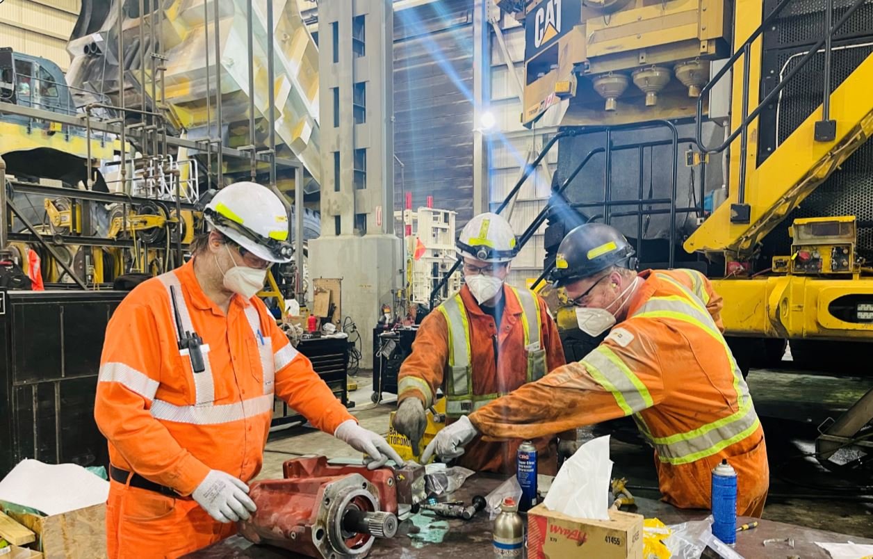 mining site with machinery and workers