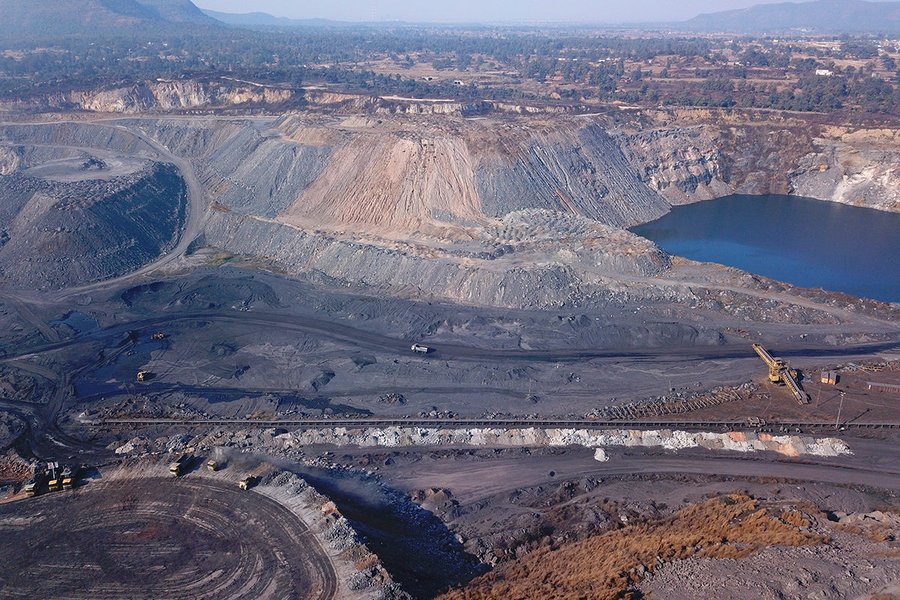 An open-cast coal mine in Jharkhand, showing large-scale excavation.