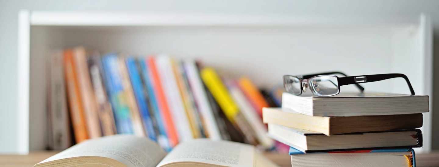 legal books and academic articles on a desk
