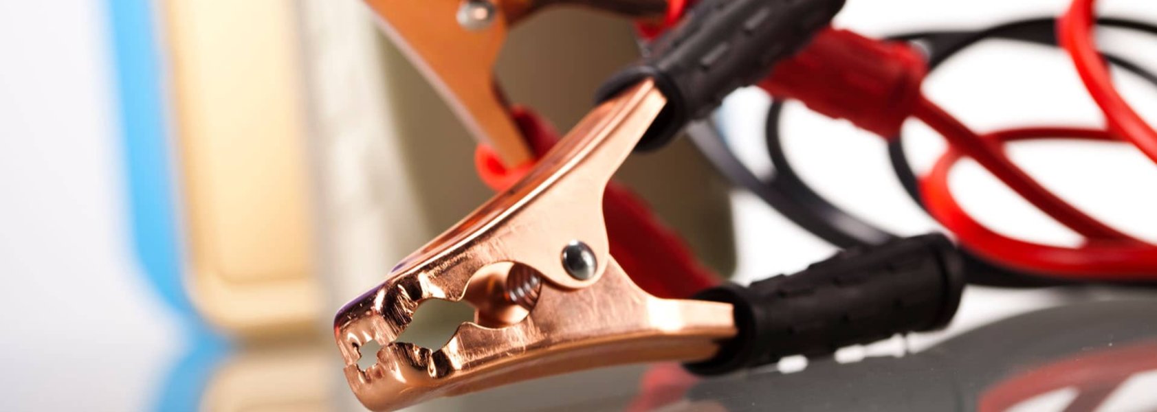 Illustration depicting the proper connection for jump starting an EV's 12V battery.