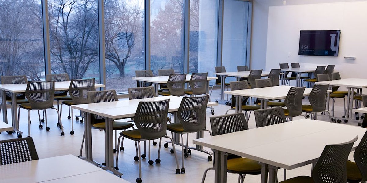 Students collaborating in a modern, flexible classroom designed for active learning