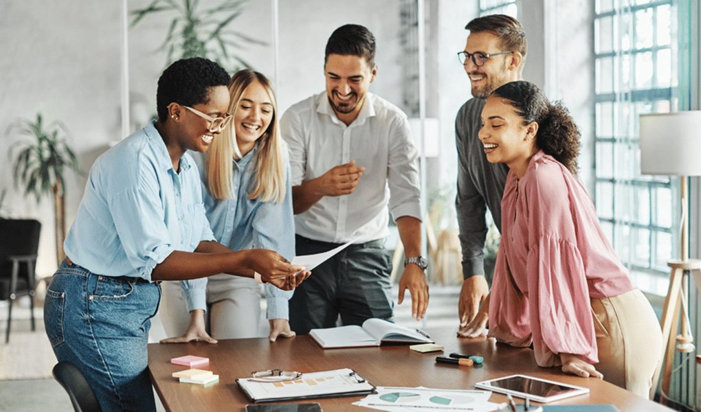 A diverse group of young professionals engaging in a networking event, fostering connections.