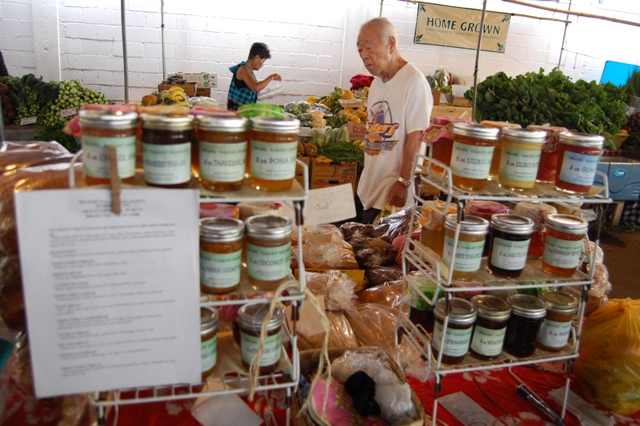 tropical fruit market stall with jam jars