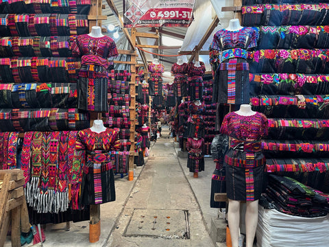vibrant traditional textiles displayed in a market
