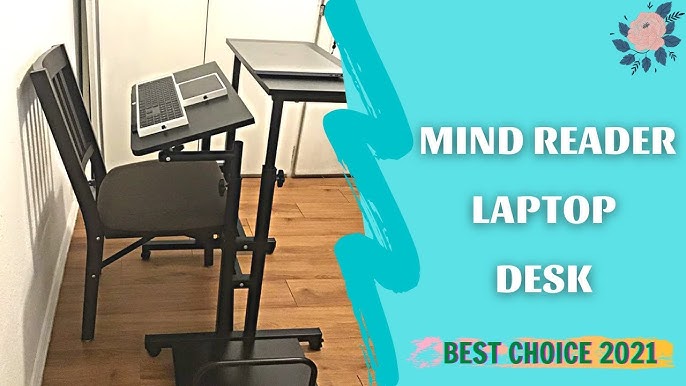 laptop instruction manual open on desk