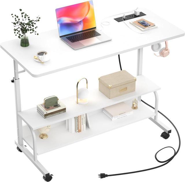 laptop on desk with manual
