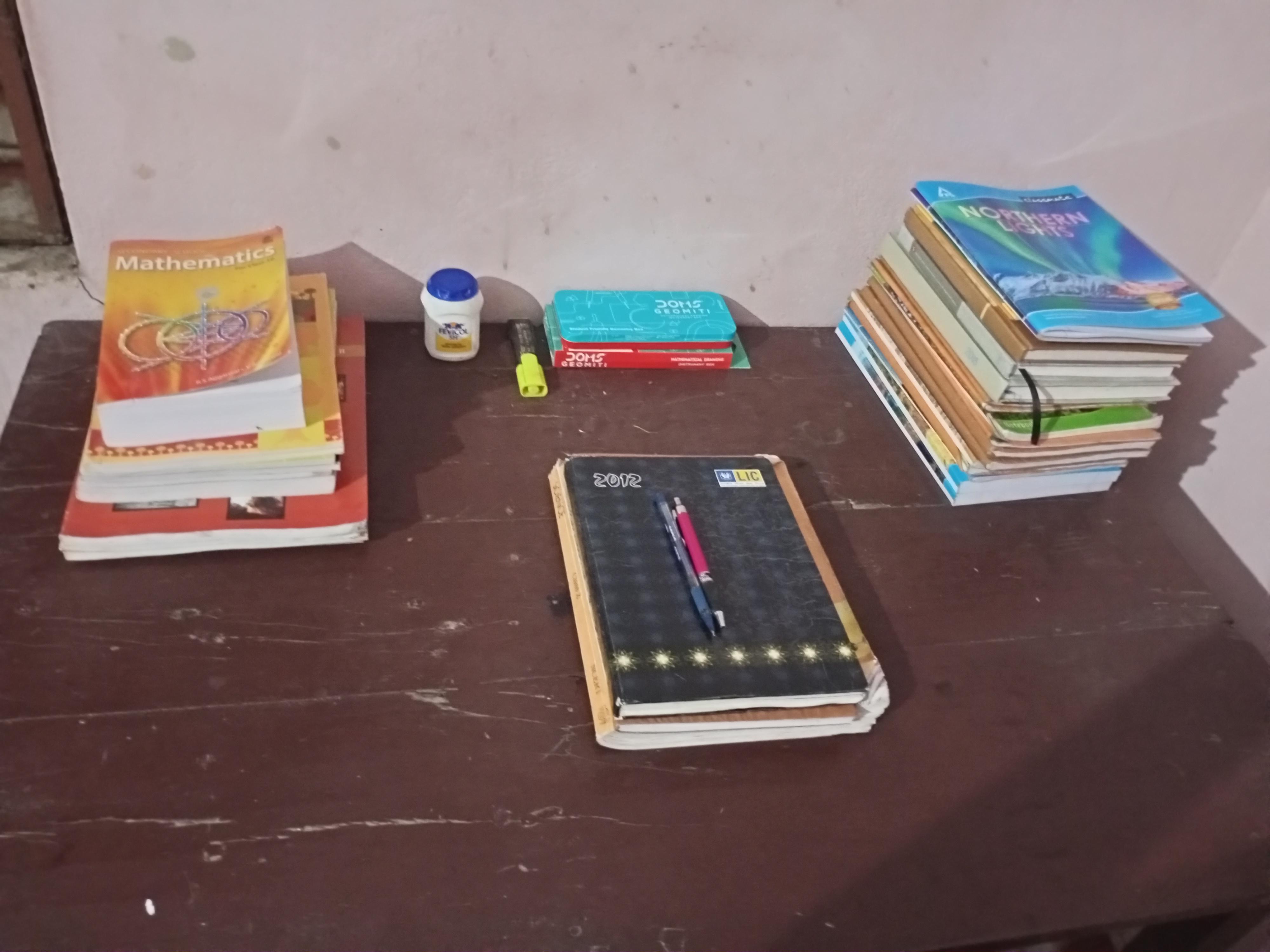 physical books and study materials on a desk