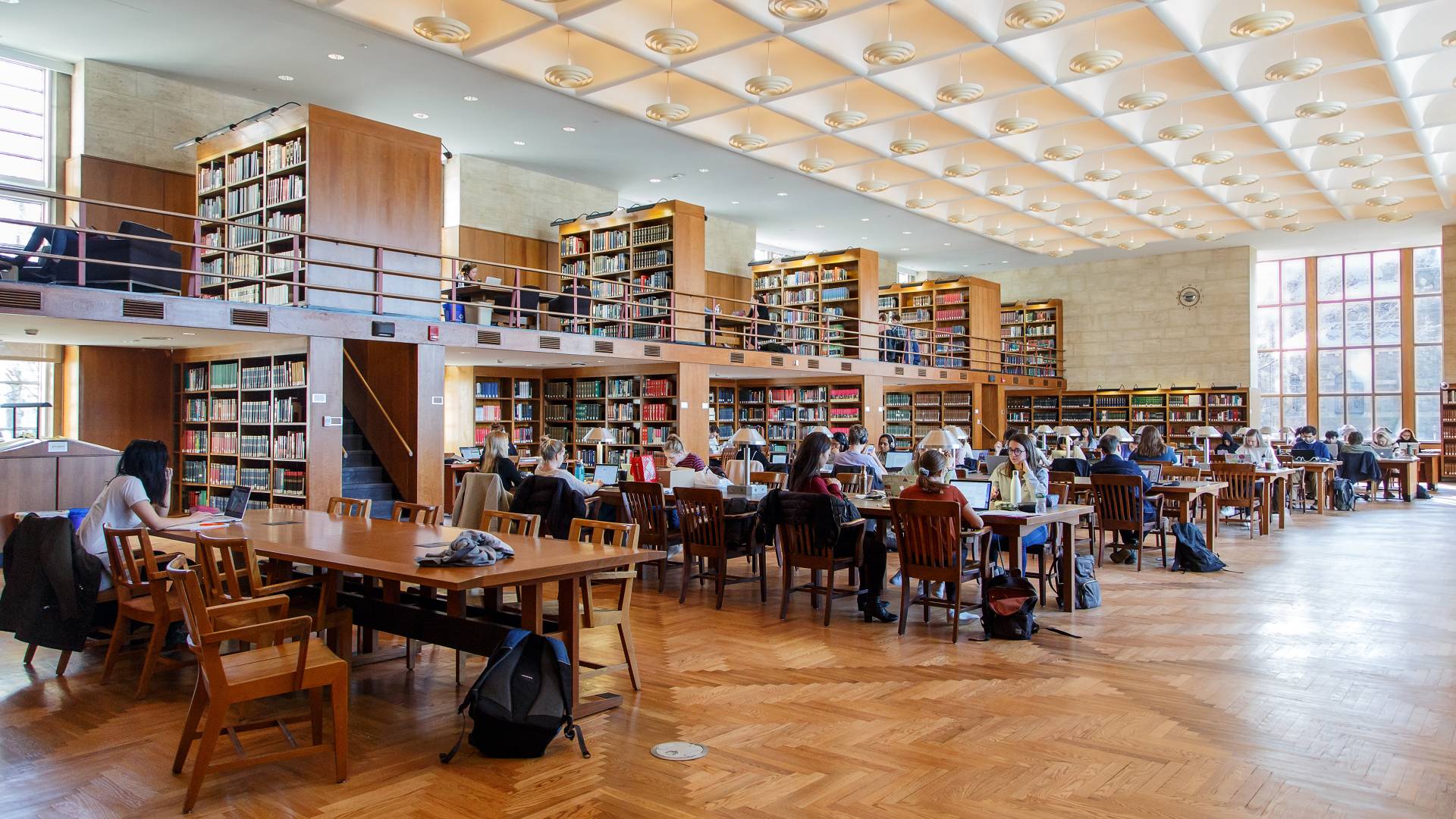 modern university campus, open book on desk, academic library