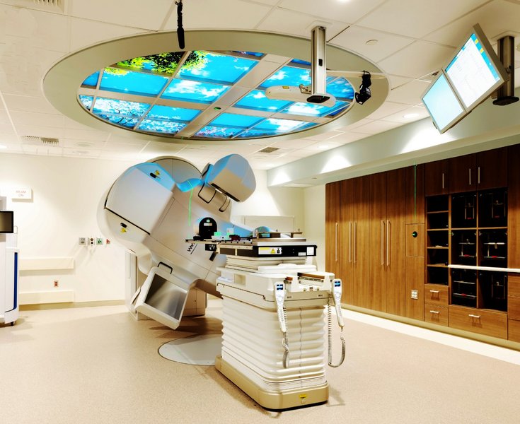 A modern radiotherapy treatment room with a LINAC.