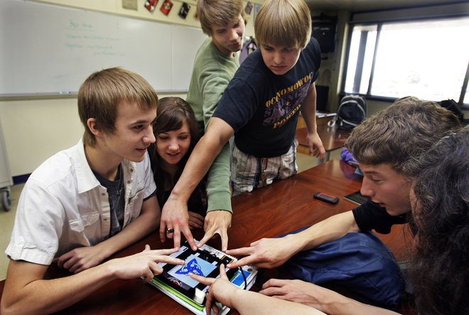 students studying mobile gaming classroom
