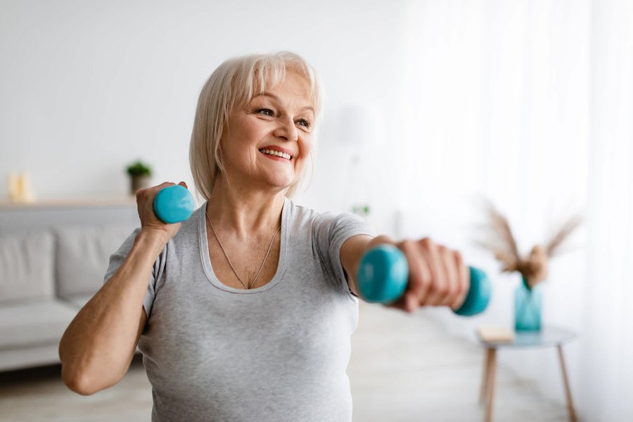 Image of a person doing light aerobic exercise indoors.