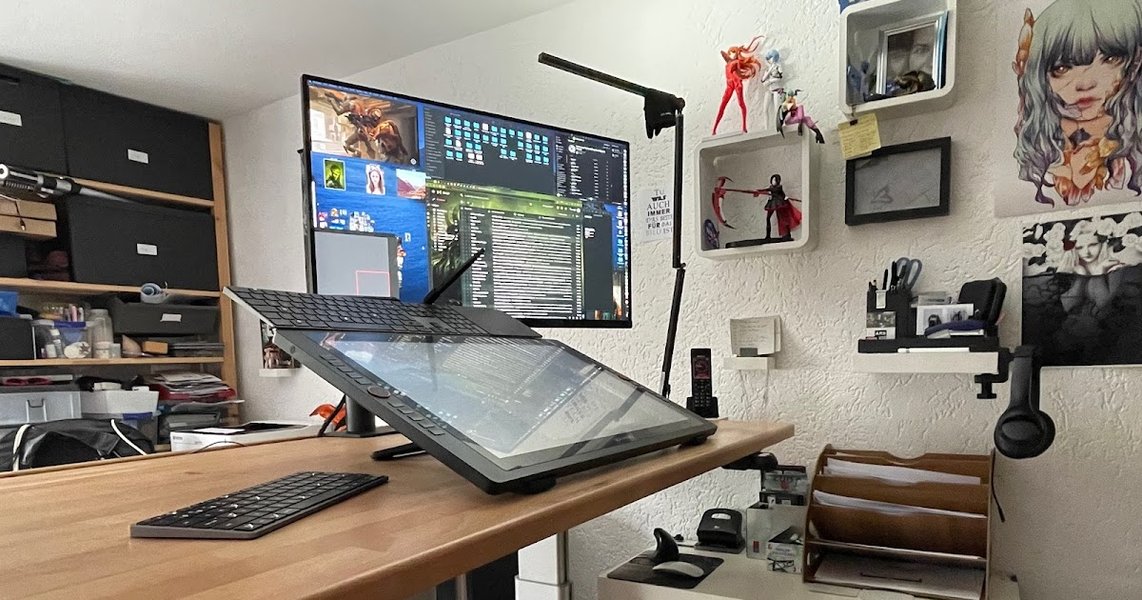 A digital artist's workstation with multiple monitors displaying art software.