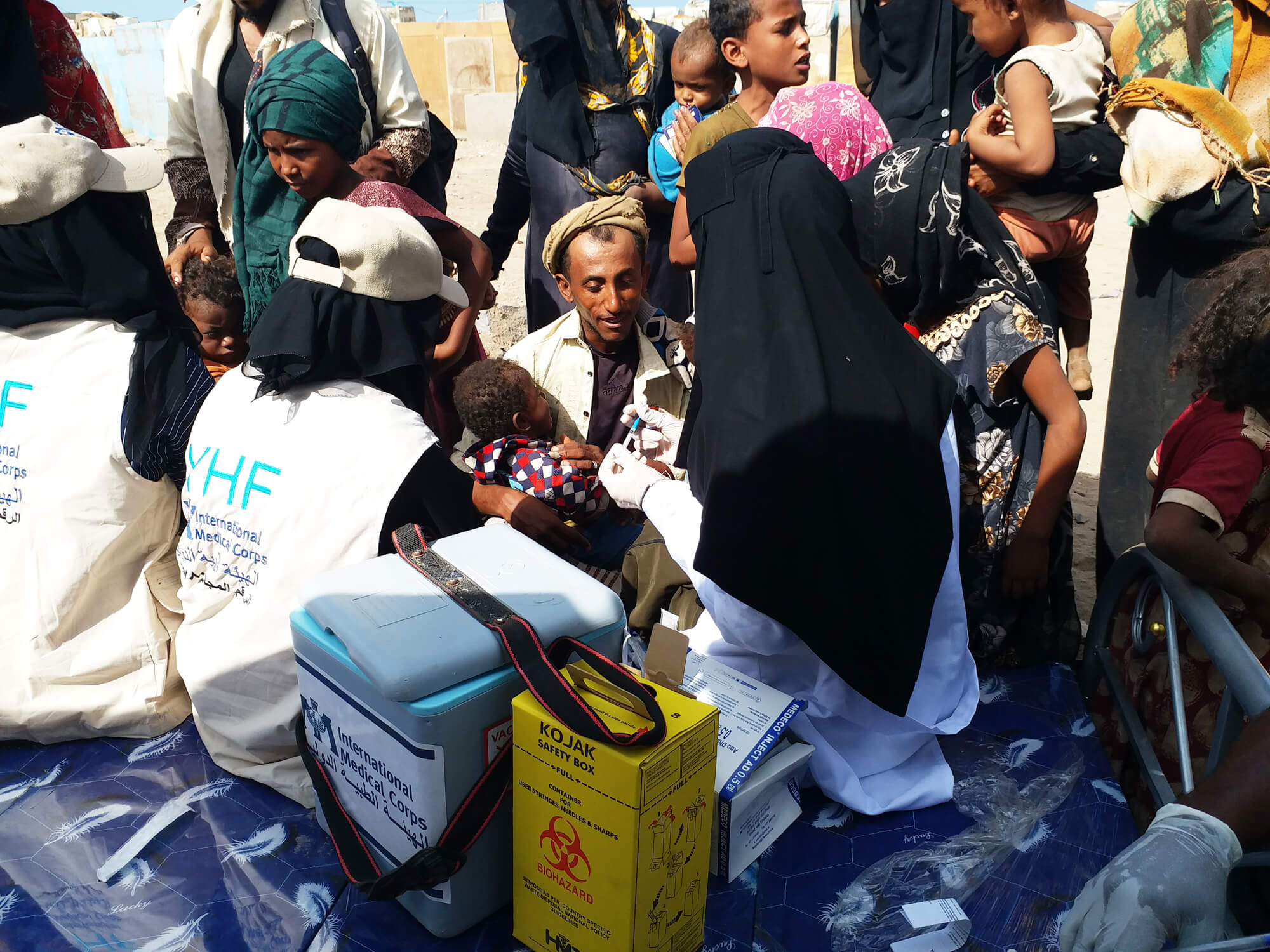 crowded local healthcare center and vaccination campaign