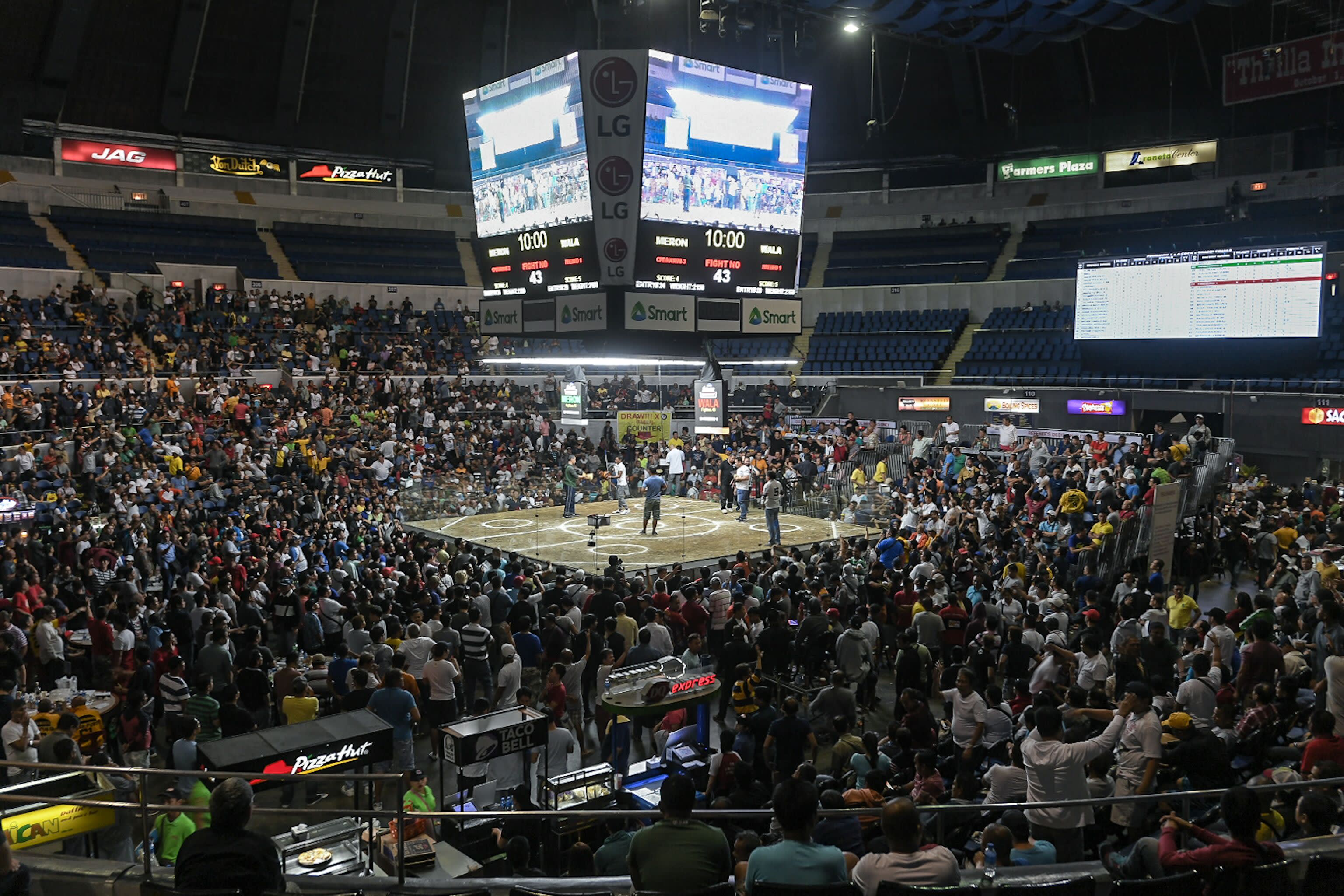 vintage cockfighting arena bustling with spectators
