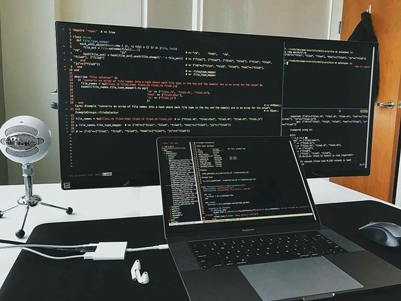 computer setup with code on screen