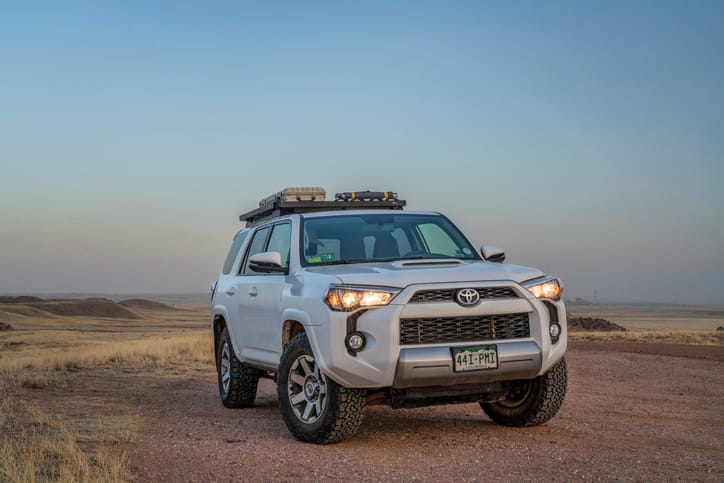 mid size SUV driving outdoor landscape