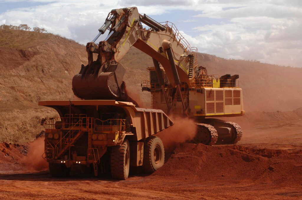 African mining landscape with machinery, open pit, and underground excavation