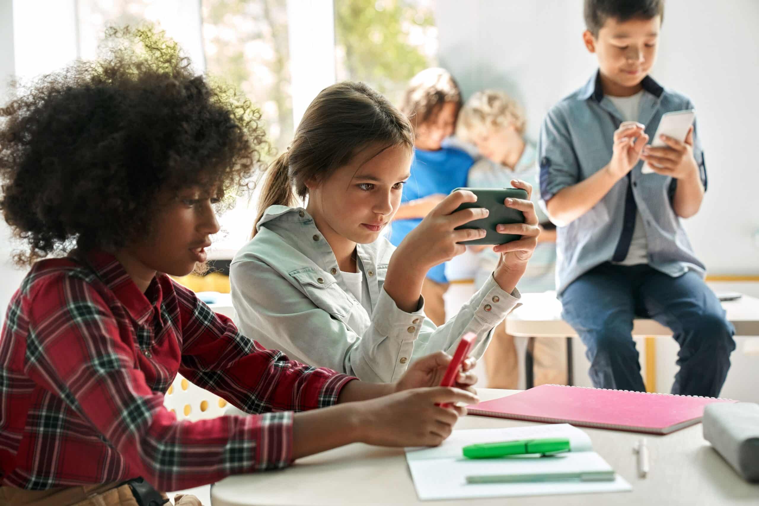 students using mobile devices balanced study and game