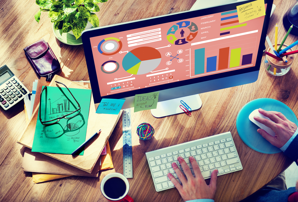 financial tools and charts on a desk