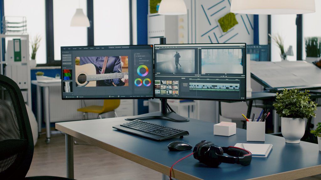 IT professional workspace with dual monitors