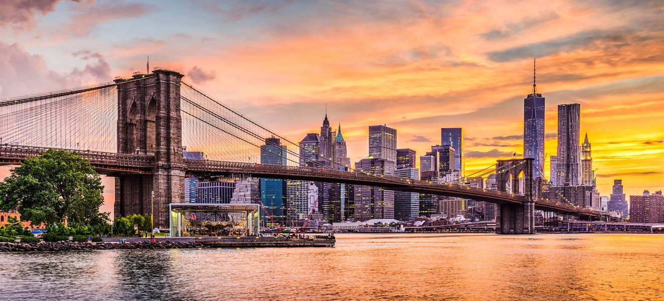 Composite image of famous New York City landmarks including the Statue of Liberty and Brooklyn Bridge