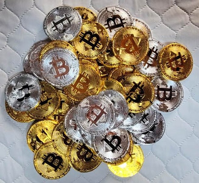A close-up image of physical Bitcoin tokens, symbolizing digital assets.