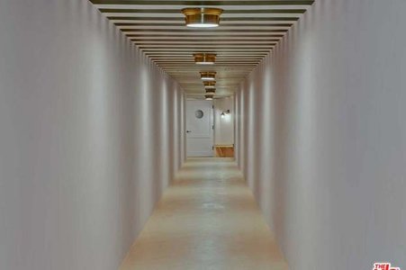 hospital corridor with bright light near tunnel entrance