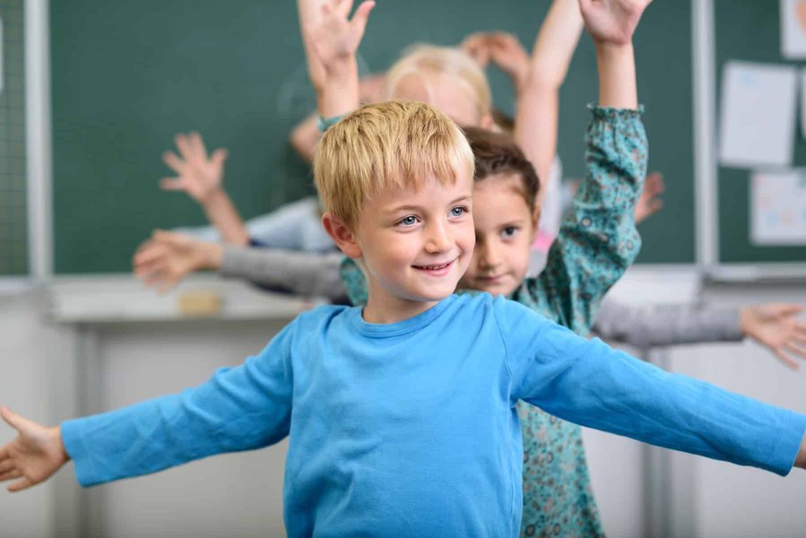 Children interacting in a classroom setting