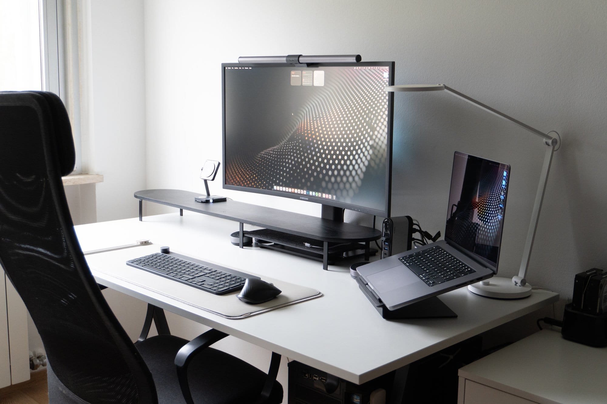 modern workspace with notebooks and screens
