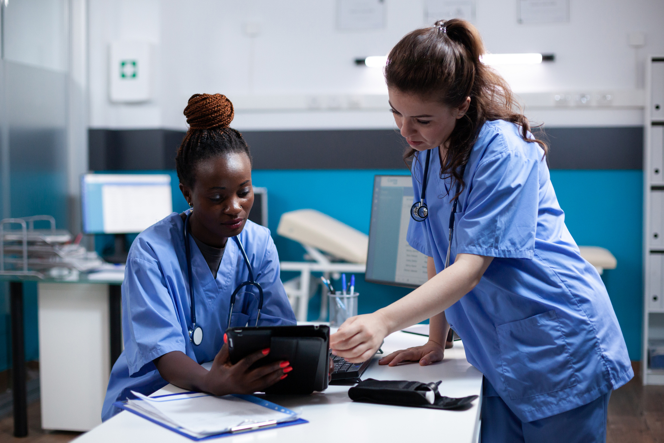 nurses working with technology at hospital