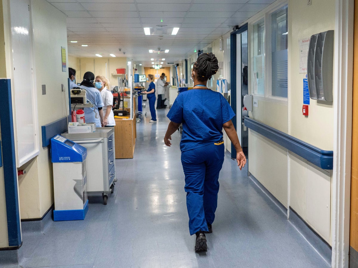 modern hospital corridor and nurses in action