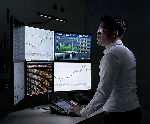 trading floor with market screens