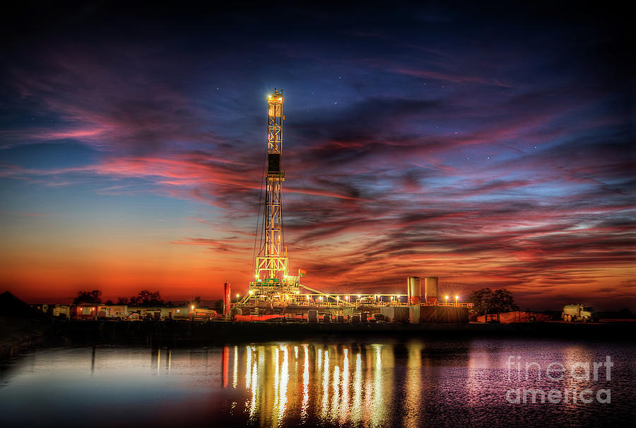 oil rigs and refinery sunset