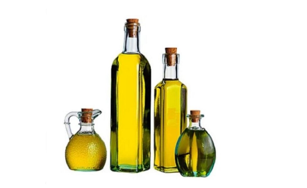 Dark glass bottles and a metal container used for storing olive oil, highlighting the importance of protecting oil from light.