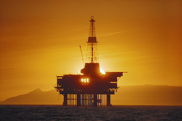 oil rig offshore sunset