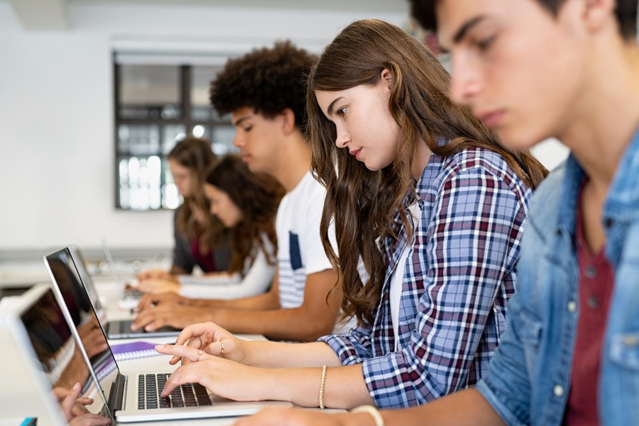 high school student study session in library with technology