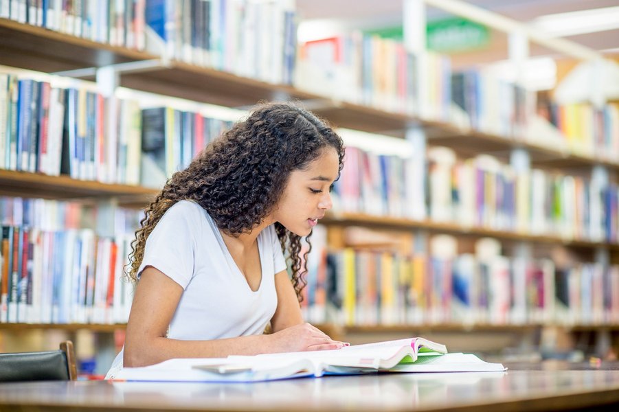 Female student studying in a library